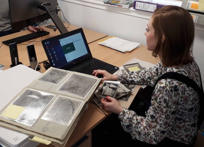 University of St Andrews student Aren Ehman digitising photographs of works from the Trust's archive. © Wilhelmina Barns-Graham Trust