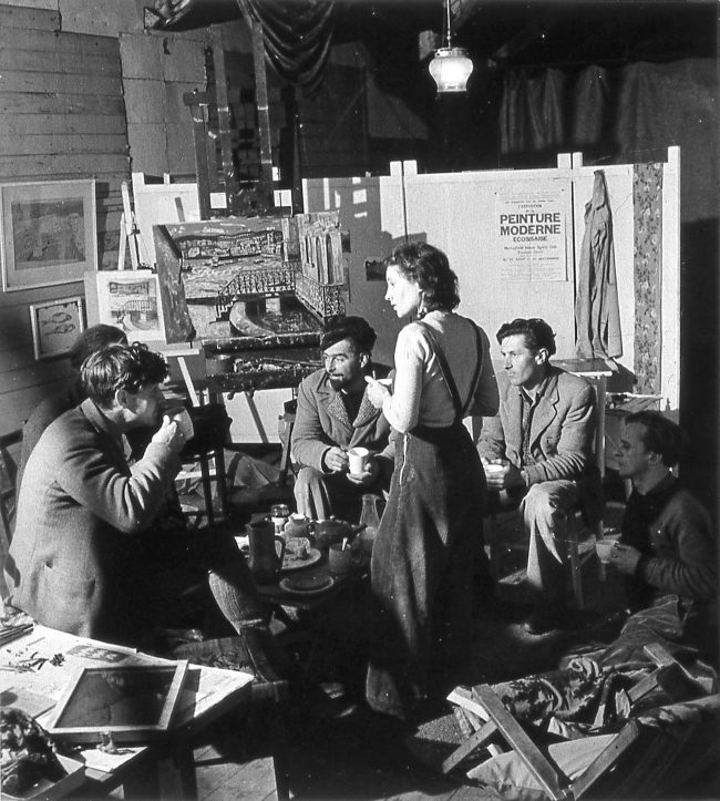 A Meeting of the Crypt Group in Wilhelmina Barns-Graham Porthmeor Studio, St Ives, 1947 Left to right: Peter Lanyon, Bryan Wynter (obscured), Sven Berlin, Wilhelmina Barns-Graham, John Wells and Guido Morris