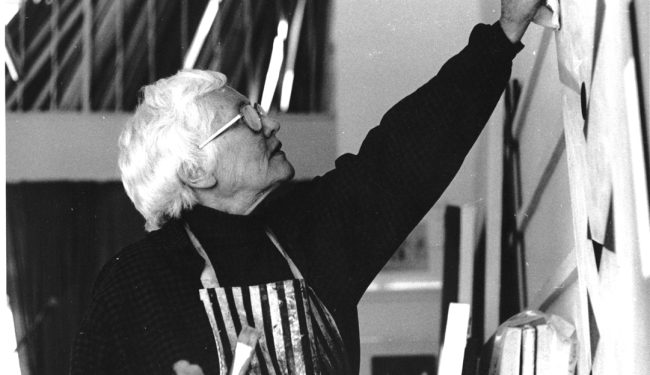 Barnaloft Studio, 1985. WBG working on an oil painting Summer Painting No.2 which is in the Barns-Graham Charitable Trust collection (BGT463). Photo: David Crane.